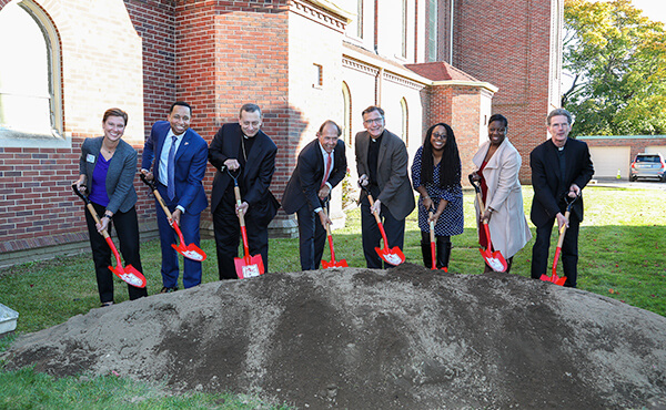 President Mark R. Nemec and others holding shovels at the Bellarmine Campus groundbreaking ceremony