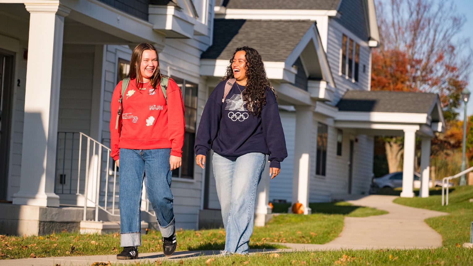 Fairfield students walking and talking on their way to class from their respective on-campus townhouses.