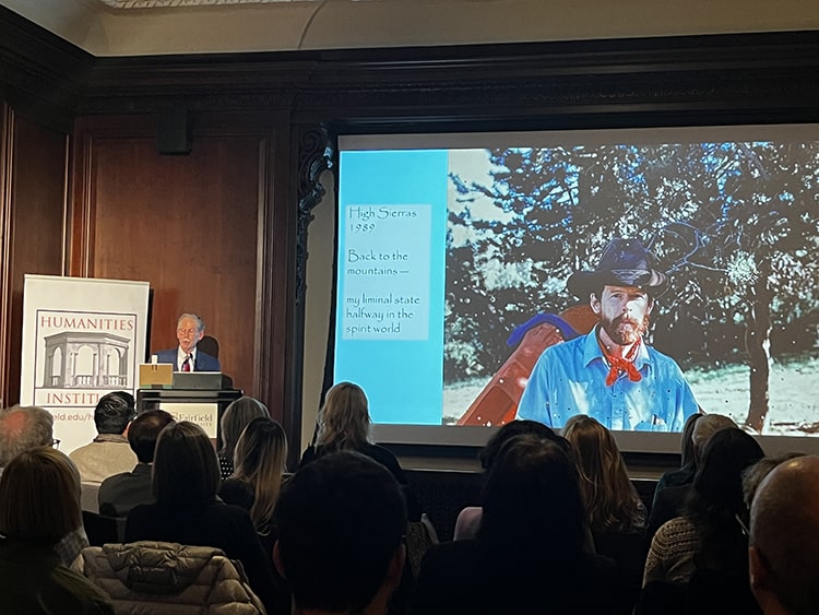Students attending a Powerpoint-accompanied lecture by professor and founding director of the Humanities Institute, Ronald Davidson, PhD.