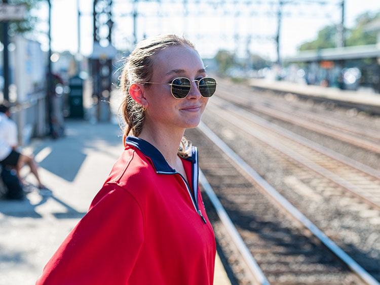 Fairfield U student waiting for the train at the downtown Fairfield station in anticipation of a daytrip to NYC.