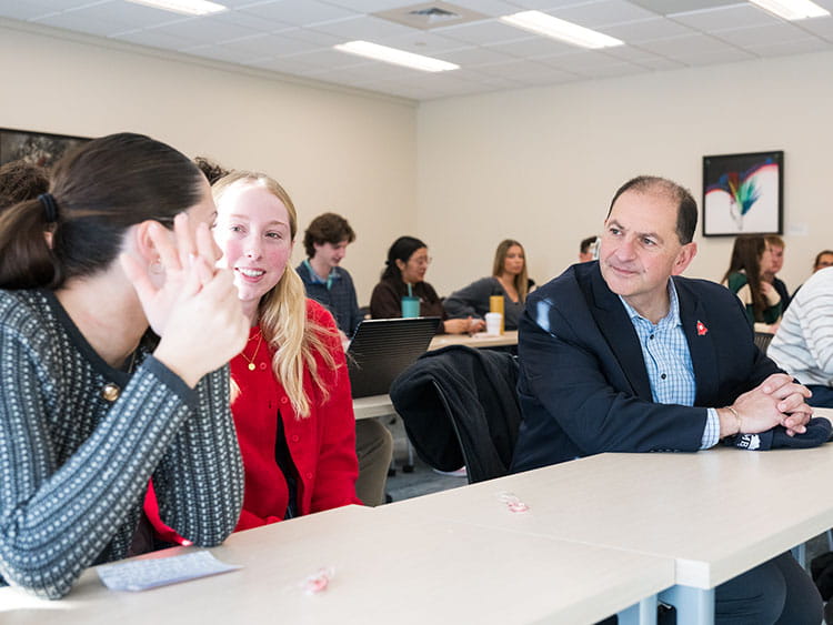 "State & Local Politics" students having a discussion in a classroom setting with the current Bridgeport Regional Business Council President and CEO.