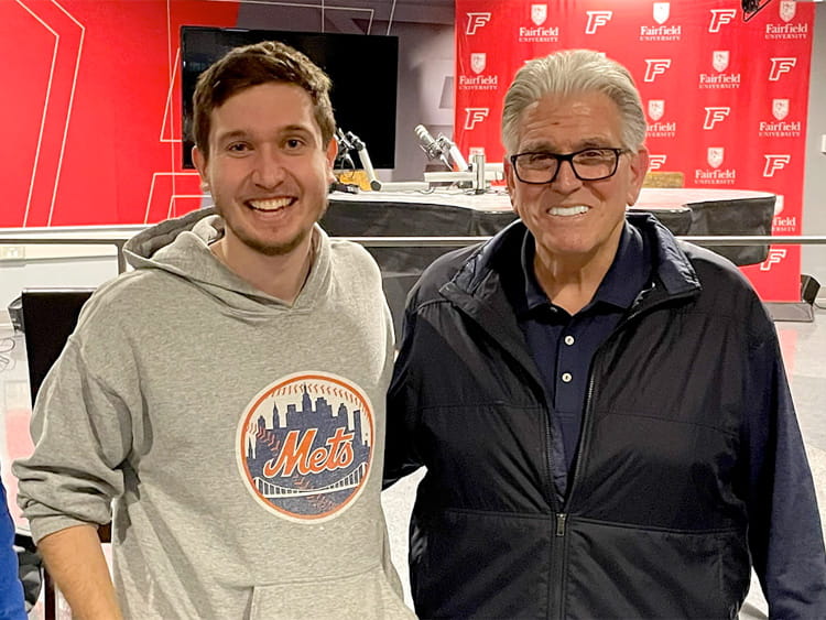 Sports media and communicator senior posing with American radio host, Mike Francesa.