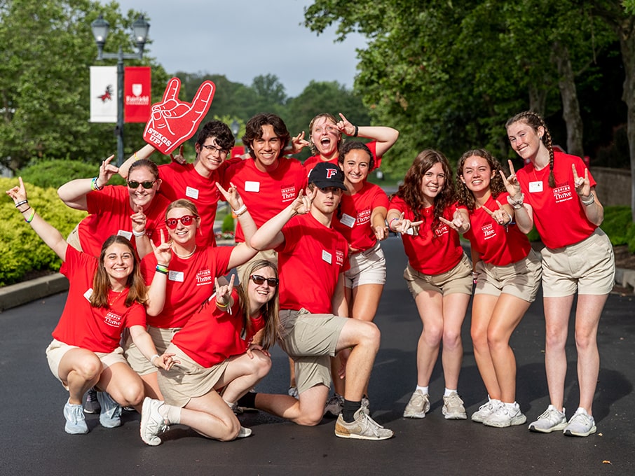 Orientation leaders posing in a group as they welcome new students to Fairfield's campus.