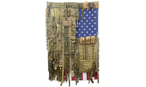 A prominent flag adorned with military gear, representing national pride and service, is displayed in the image.