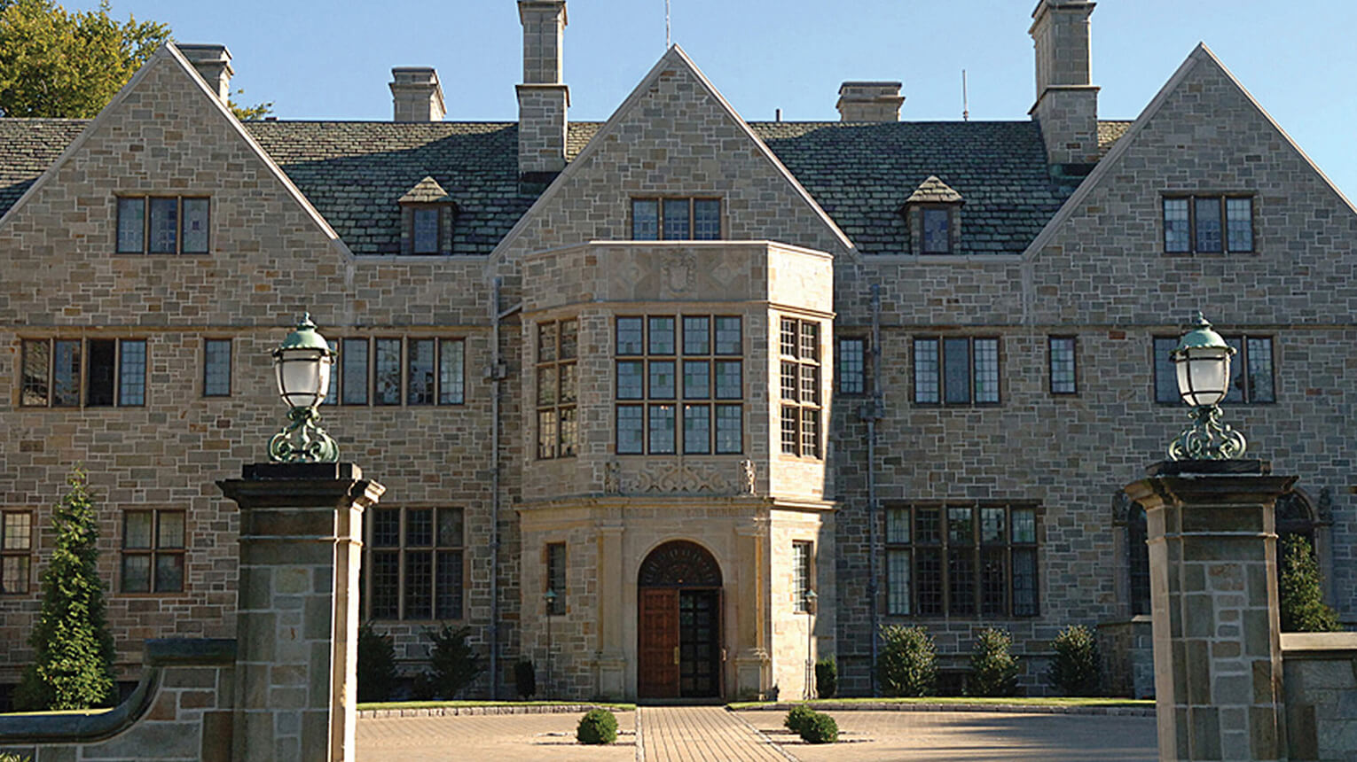 A prominent stone Bellarmine Hall showcasing robust construction and traditional design elements.