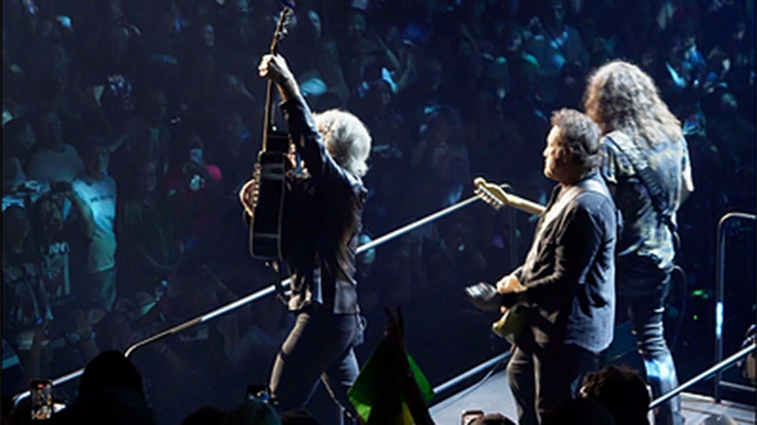 A still shot from Ryan's camera, showing Bon Jovi lifting his guitar mid-performance.