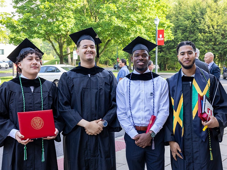 Four associate degree recipients of Fairfield Bellarmine posing for a photo during the post-Commencement ceremony celebration.