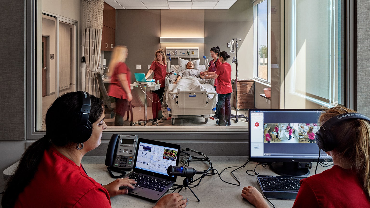 Realistic render of Nursing students in a projected layout of a new simulation lab in the Fairfield Egan building.
