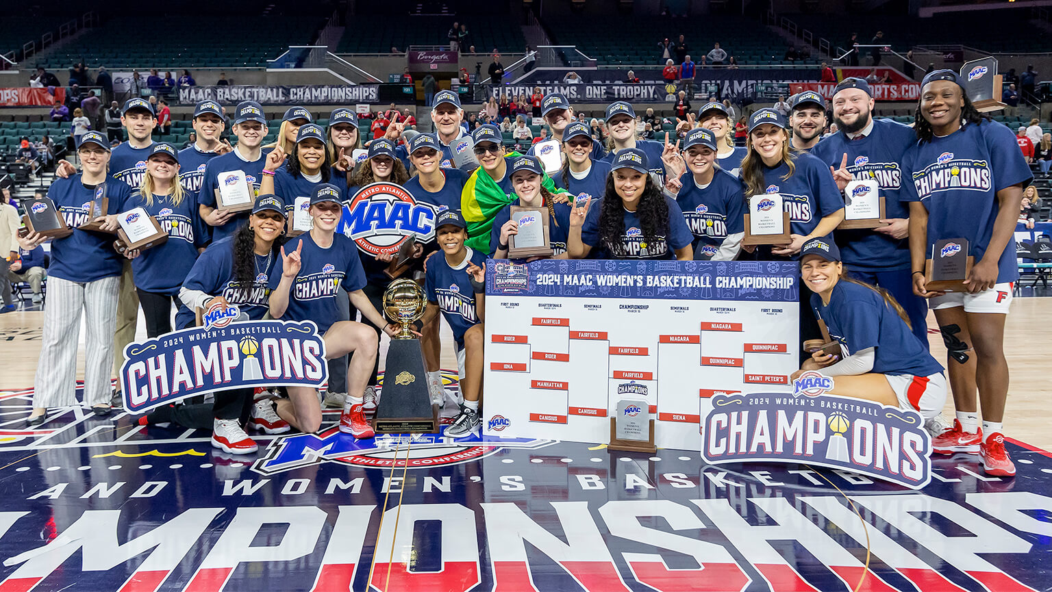 The Fairfield Women's basketball team proudly poses with their trophy, showcasing their achievements and team spirit. 