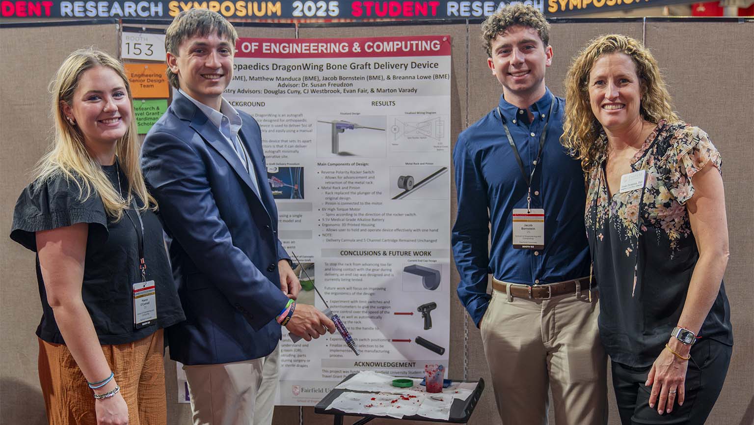 Image of engineering students posing at the annual student research symposium
