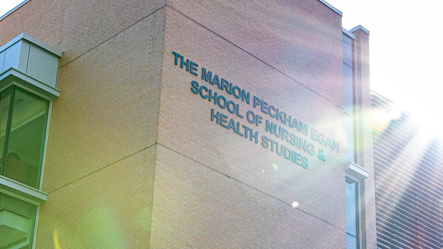 The Fairfield Egan building featuring its brick exterior, showcasing architectural details.  