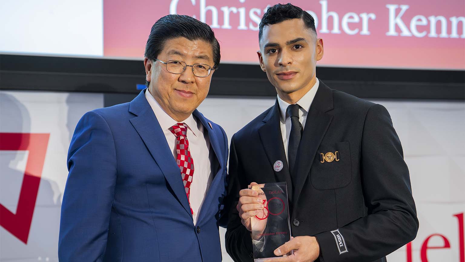 Image of Christopher Kenney MBA ’25 with Dean of the Dolan School of Business, Zhan Li, DBA at the 47th Annual Dolan Awards Ceremony