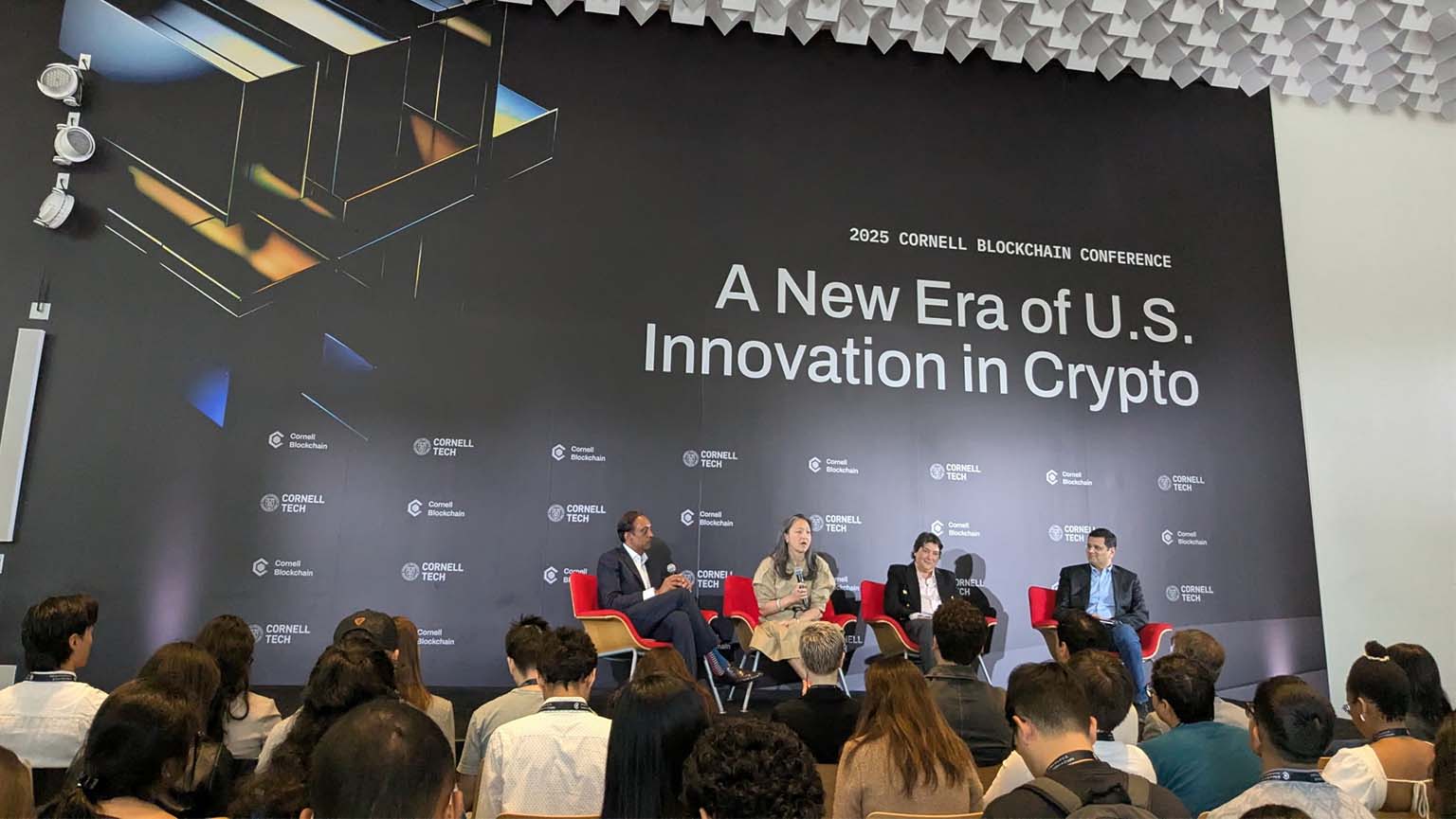 Image of panelists discussing the latest innovations and trends in the cryptocurrency industry during a lively discussion.