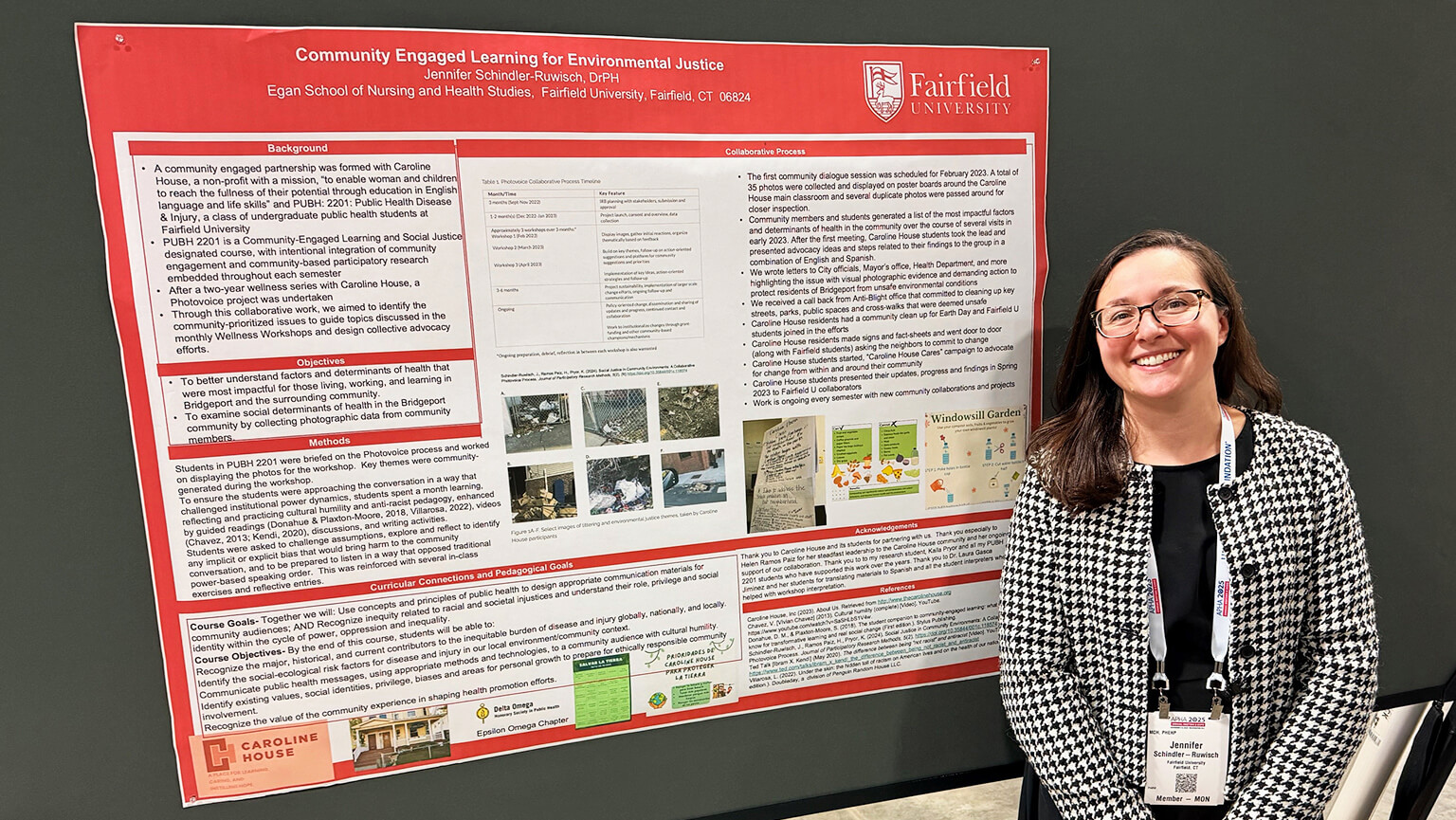  A woman stands beside a poster board displaying informational content. 