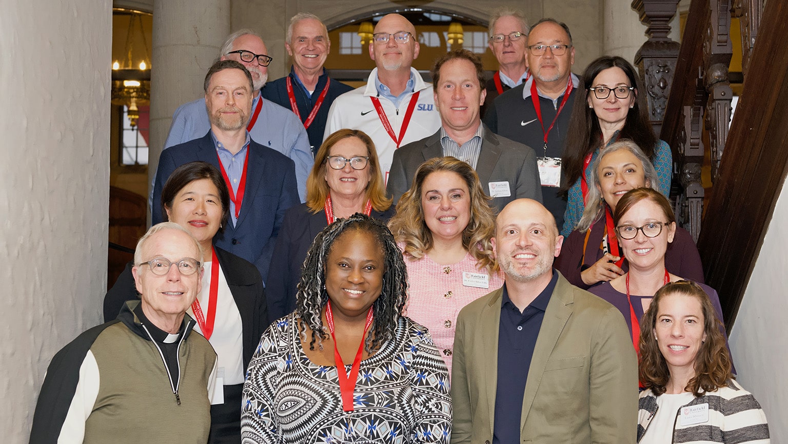 Attendees of this year's AJCU deans conference (held on Fairfield University's campus) smiling and posing as a group.