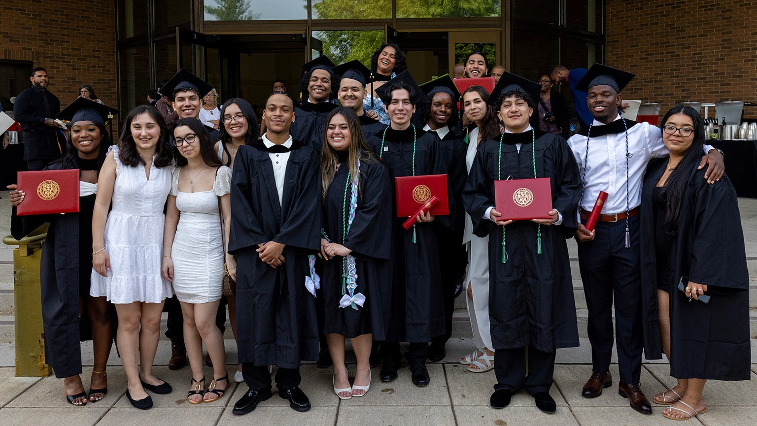 Thirty-five graduates from Fairfield Bellarmine posing for a group photo during their post-Commencement celebration.