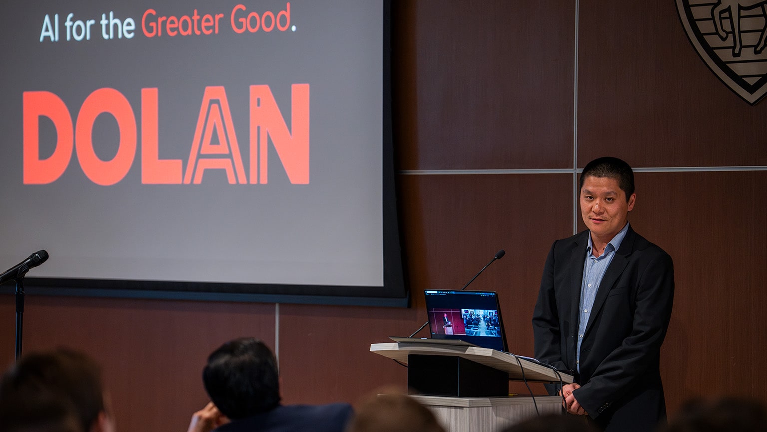Fairfield business analytics professor presenting his research on 'AI for the Greater Good' via a lecture.