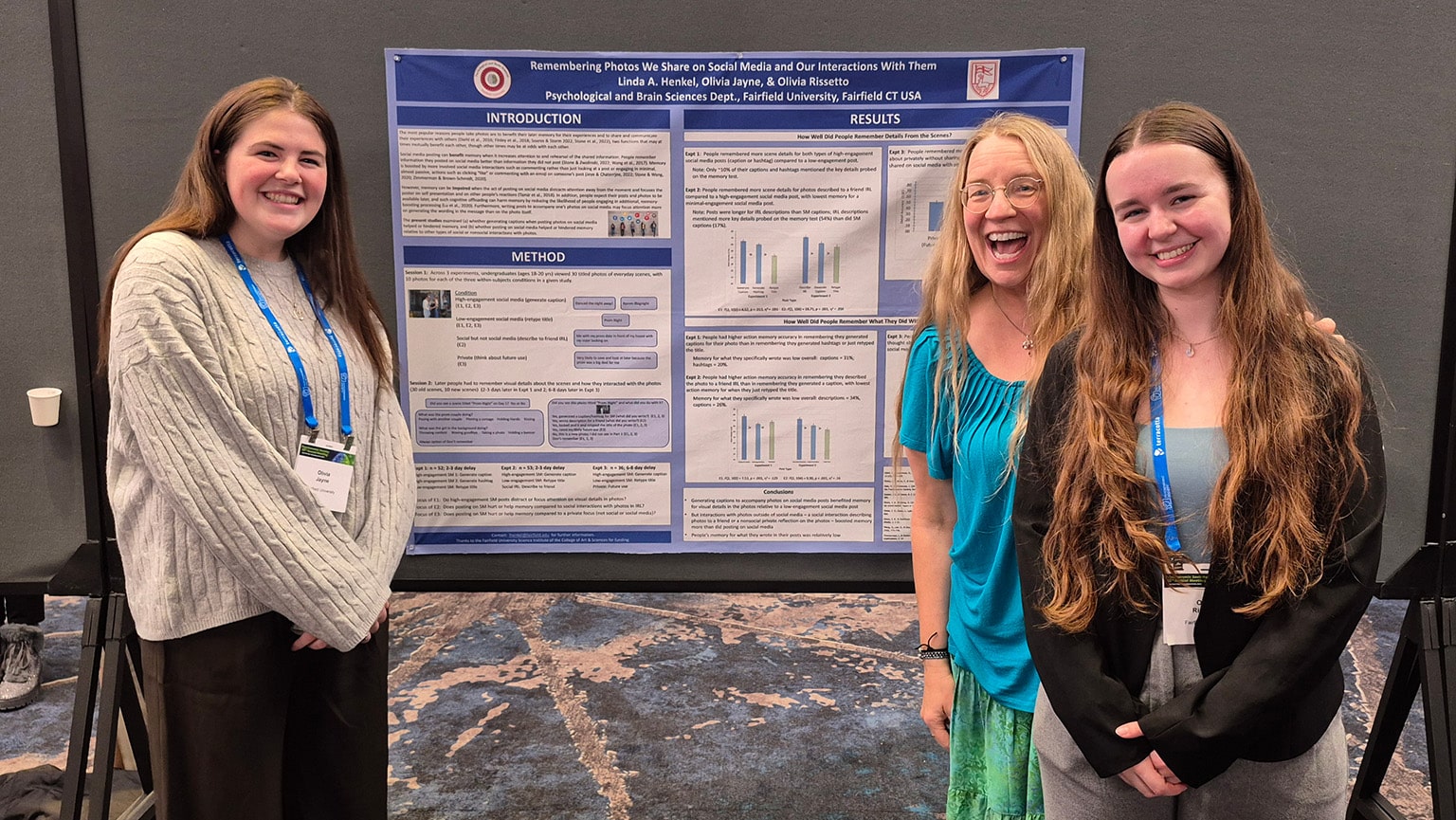 Dr. Linda Henkel with two students presenting their research on 'remembering photos we share on social media and our interactions with them'.