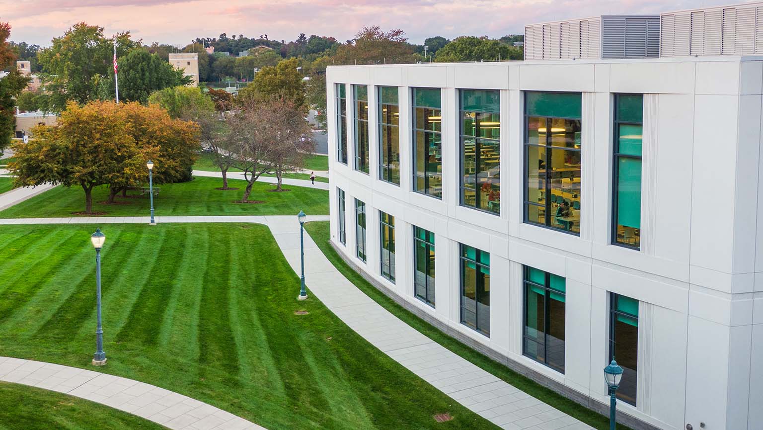 Aerial view of the campus showcasing buildings, green spaces, and pathways.