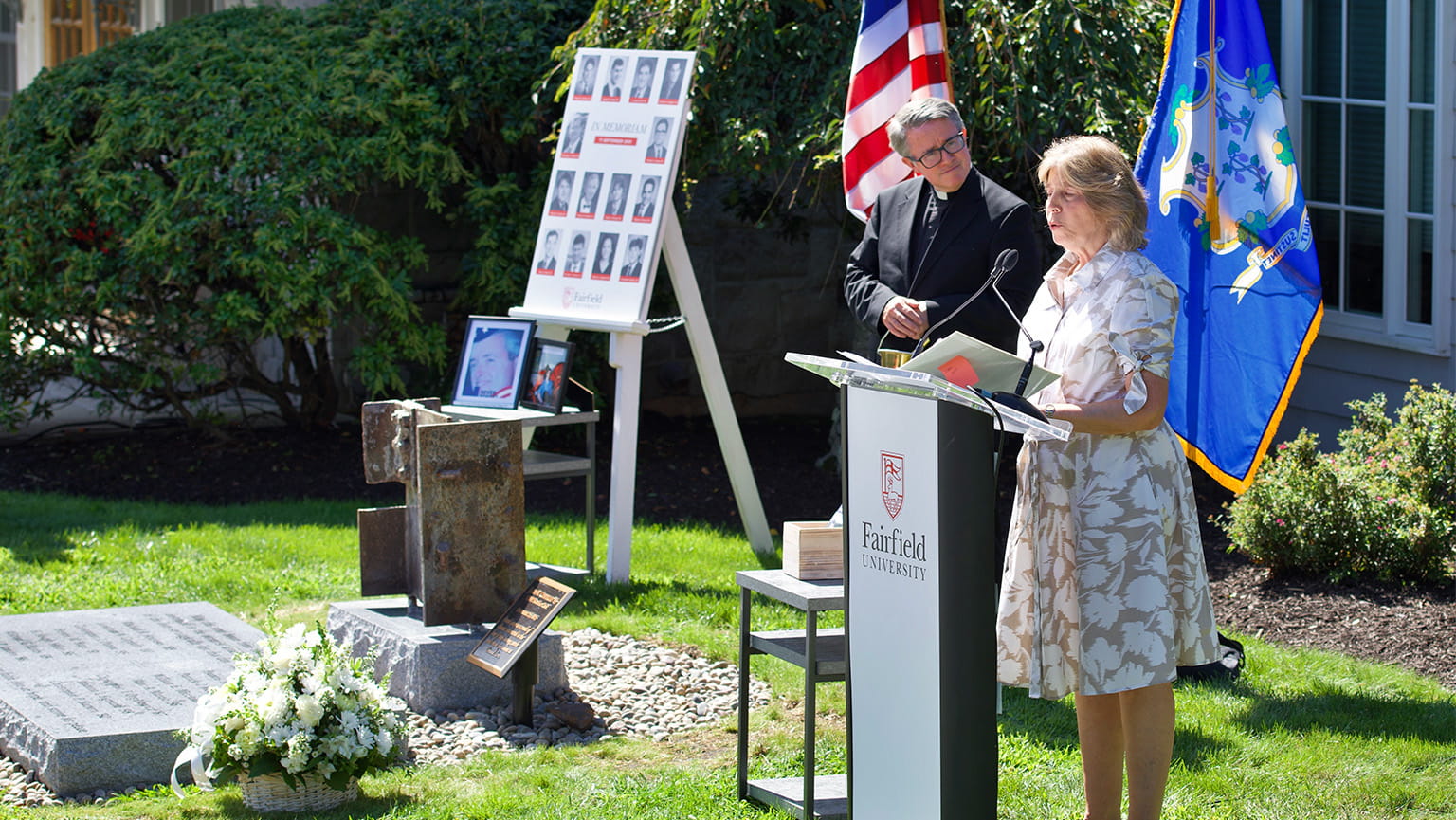 Asst. vice president of alumni relations (Janet Canepa) and Fr. Paul O'Rourke read the names of the deceased at Fairfield's 9/11 memorial.
