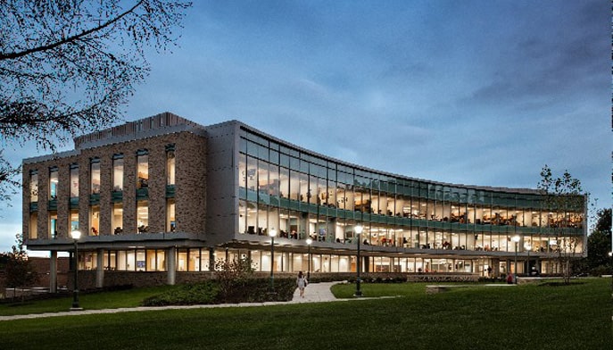 Image of the Dolan School of Business building at night