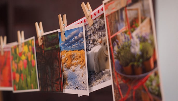 many photos clothespinned to a string