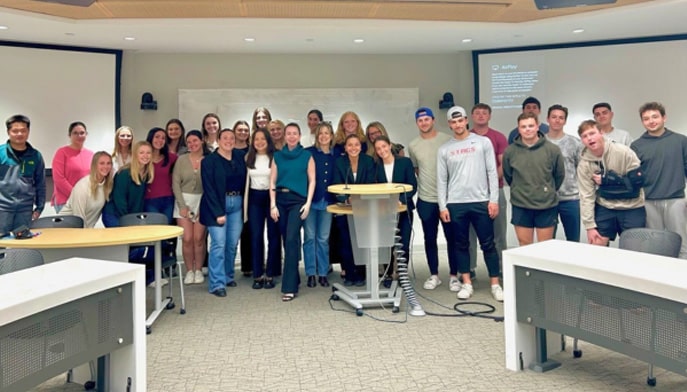 Group photo of Fairfield Dolan students with Here for You founders Ellie Haney and Emma Kilbride.