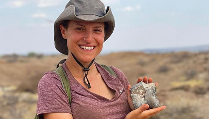 Dr. Francis Forrest holding a fossil at Koobi Fora site in Kenya.