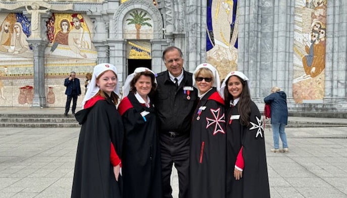 A group photo of Amanda Marino ‘25, Dr. Katherine Saracino, Joseph Berardino ‘72, Gail Berardino, and Samantha Flores ’25 outside the Basilique Notre Dame du Rosaire in Lourdes, France.