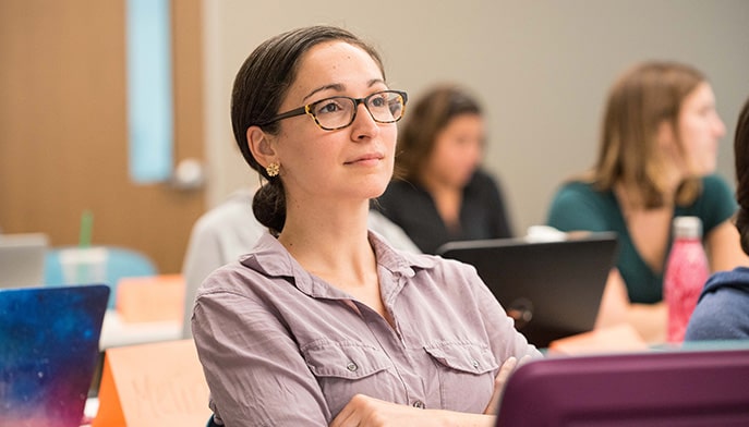 Nursing student listening to a lecture.