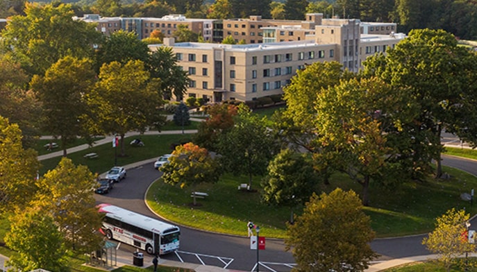 Aerial shot of the lush, green Fairfield University campus on a bright, Fall day.