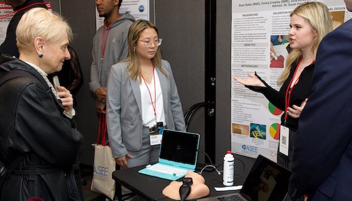 Students from both the school of computing and engineering and Egan school of nursing and health showcasing their research