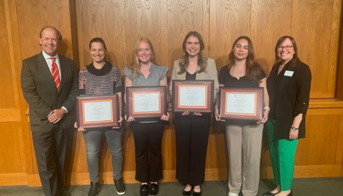 President Mark R. Nemec, PhD, and Dean Christina McGowan with 2024 Library Research Prize winners.