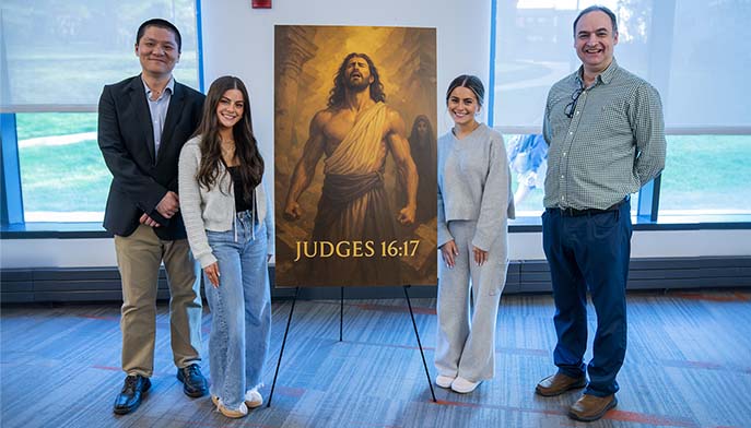 Image of Dolan students with film poster on April 28th event. As part of the AI and Tech Institute Launch, five AI-generated student films were showcased.
