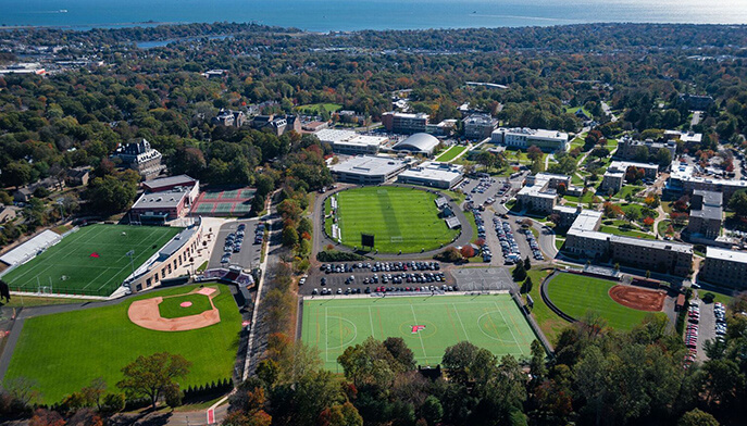 Aerial view of a Fairfield University campus featuring a baseball field surrounded by academic buildings and green spaces.