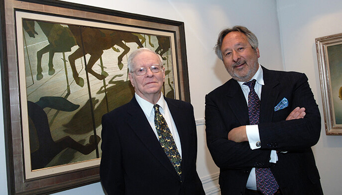 Two men stand side by side in front of a large painting, engaged in conversation and admiring the artwork.
