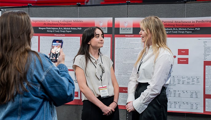 Students coordinating as they present their research at the annual symposium.