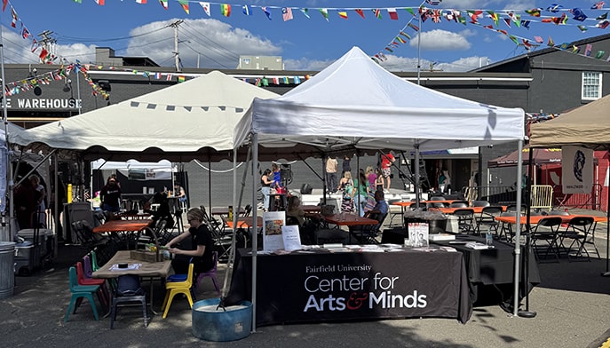 Outdoor vendor tents hosting tables for Fairfield's Center for Arts & Minds at Fairfield Theatre Company.