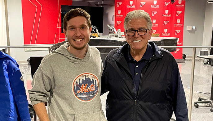 Sports media and communicator senior posing with American radio host, Mike Francesa.