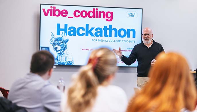 A man presenting to an audience, engaging them with his speech and visuals.
