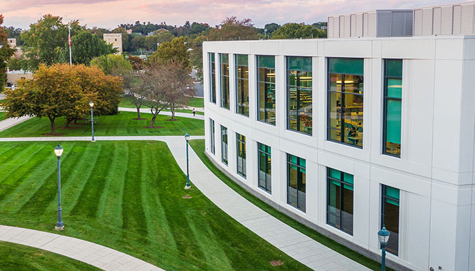 Aerial view of the campus showcasing buildings, green spaces, and pathways.