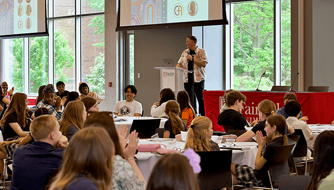 Connecticut Writing Project–Fairfield student participants attending a conference lecture in an event space on Fairfield's campus.