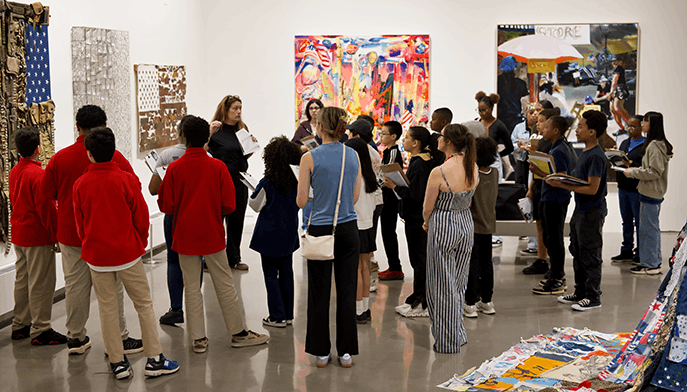 Workshop students visiting the Fairfield University Art Museum's 'For Which it Stands...' exhibition, which features varying depictions of the American flag.
