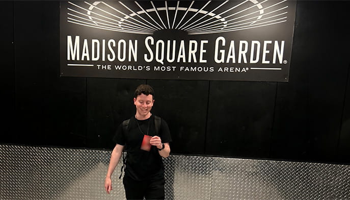 Ryan Morgenstern ’26 showing off his (blurred) backstage pass to Madison Square Garden, granted to him to capture conten for Bon Jovi's nine-show run at the arena.
