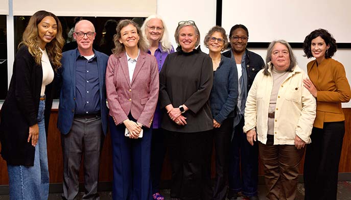 A group of people gathered together, posing for pictures