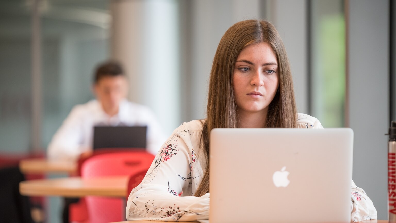 A student works on her laptop. 