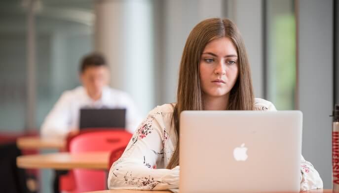 A student works on her laptop. 