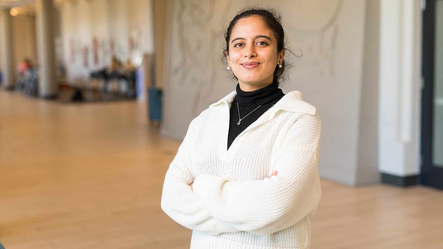 Fulbright scholar and PhD candidate Houyame Hakmi smiling and posing proudly for the camera in the BCC.
