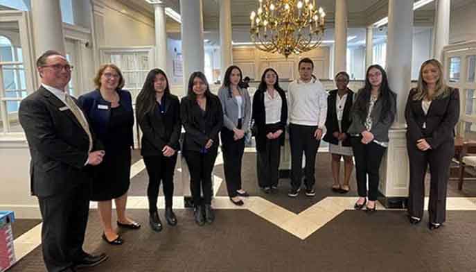 Fairfield University student meeting with Bank of America employees