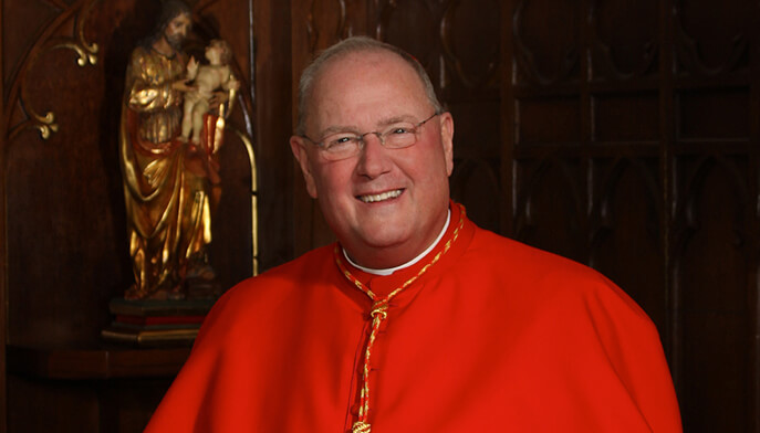 A cheerful man dressed in a red cardinal's robe, radiating positivity and friendliness.  
